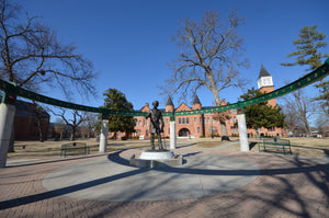 sequoyah statue with seminary hall at northeastern state university in tahlequah Oklahoma in the background 